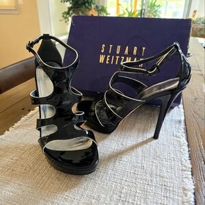 Stuart Weitzman Black Patton Leather High Heal Shoes with White piping detail.